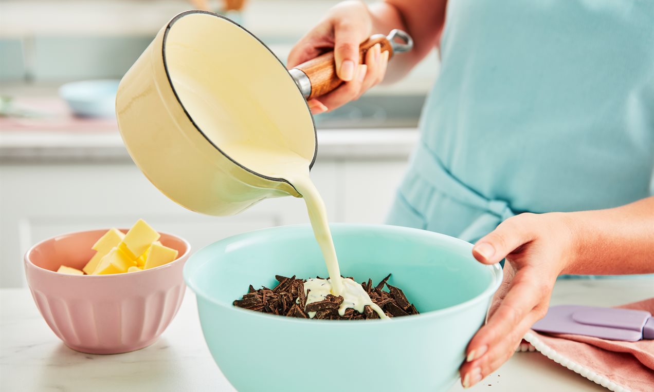 Pouring Cream into Bowl of ganache